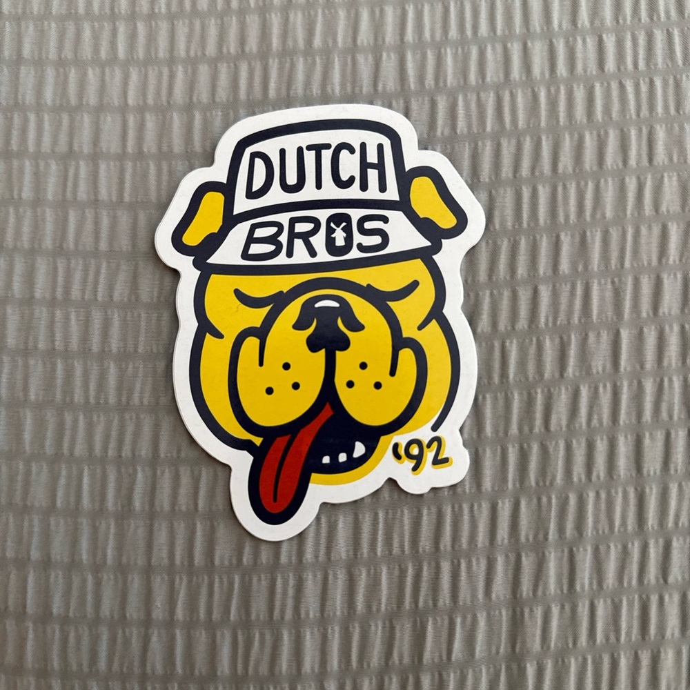 Dutch Bros Yellow and Black Dog Emblem
